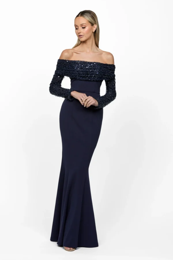 Kiara B63D24 by Bariano. Long sleeve off the shoulder formal dress with sequin cuff & sleeves. Sleeves are detachable. Navy front