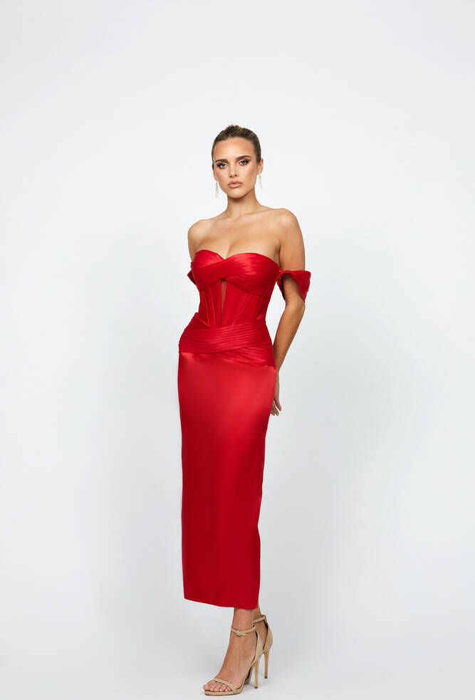 Elyse Off the Shoulder Midaxi B74D50L by Bariano features a sweetheart neckline, exposed boning and sheer mesh on bodice, detachable pleated sleeves, cross waistband feature, fitted column midaxi skirt with back split, fully lined . Gloss satin fabric shown in red
