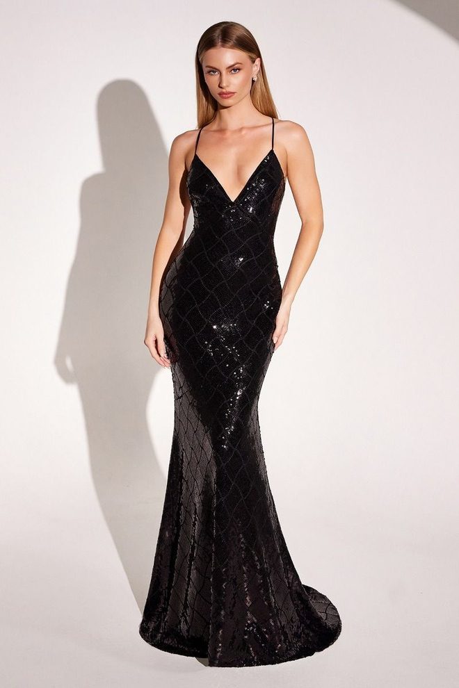 Model wearing the Giva black sequin mermaid gown with spaghetti straps, plunging neckline, and a fitted silhouette that flares at the hem.