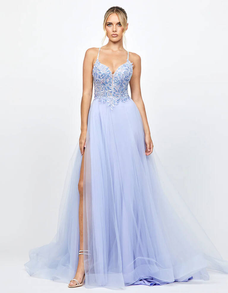 Adina Tulle Ball gown B79D15L Light purple tulle and lace ball gown with sheer appliqué bodice, strappy open back, and A-line skirt featuring a side slit and flowing hemline.