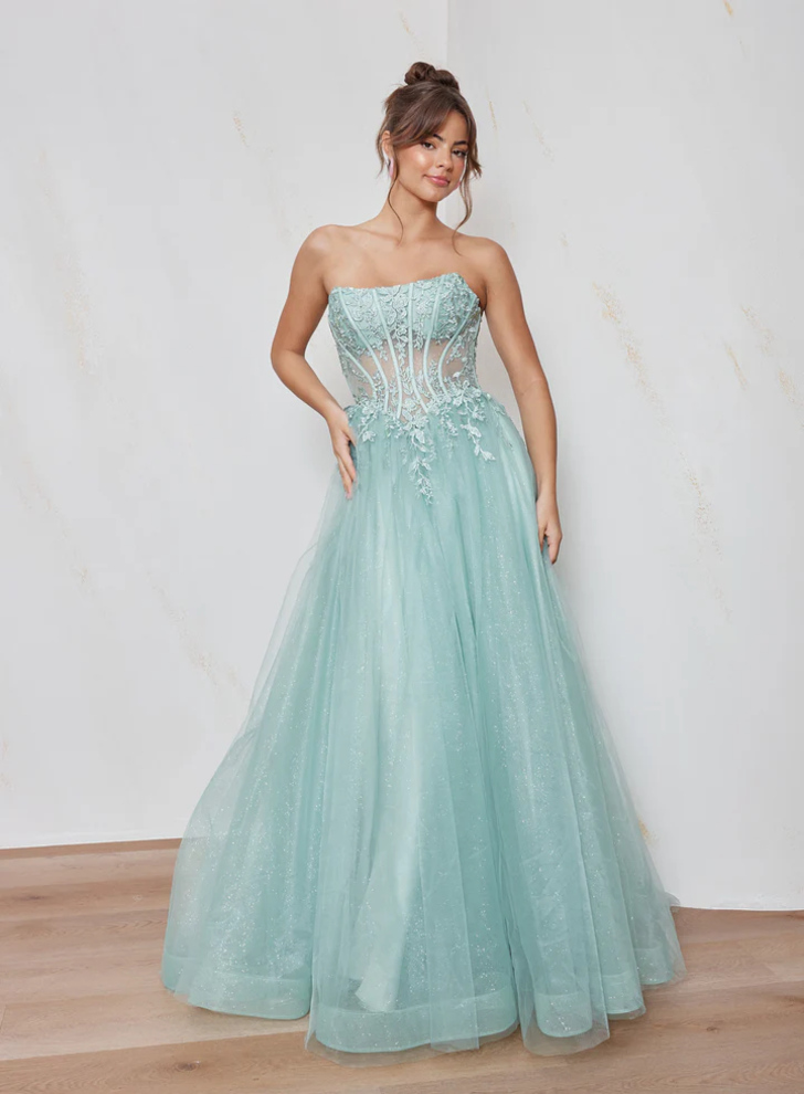 Front view of the Clara Formal Dress PO2678 by Tania Olsen Designs in soft blue glitter tulle with strapless scoop neckline, illusion bodice, lace appliquรฉ, and full A-line skirt.