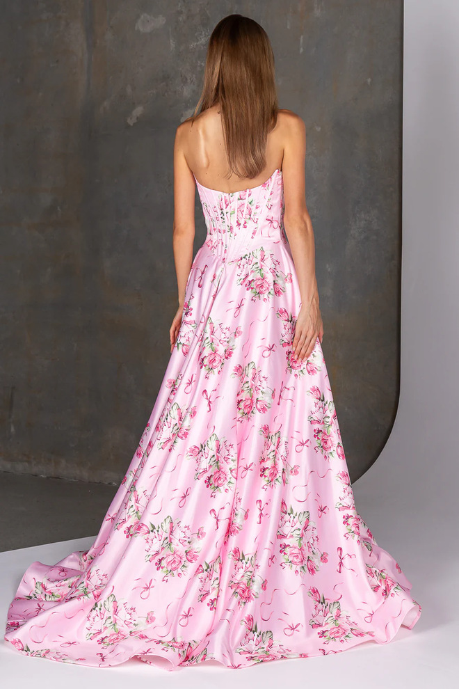 Back view of Durie PO26134 by Tania Olsen Designs showing pink floral satin A-line skirt, scoop back, structured corset bodice and zip closure.