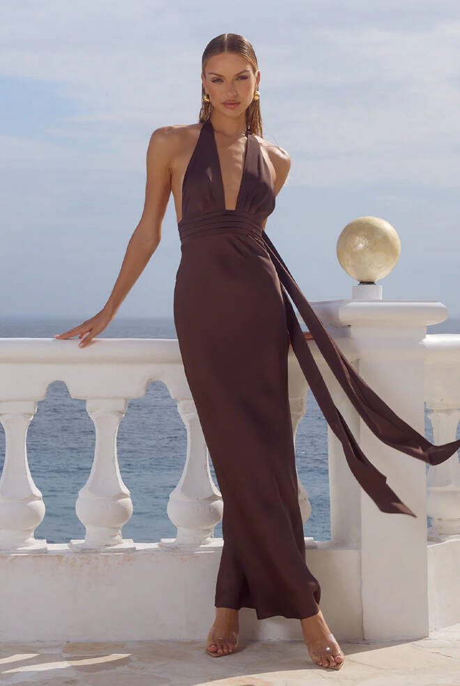 Front view of Sylvie Maxi Dress in bitter chocolate with plunging halter neckline, pleated bodice and flowing neck sashes.