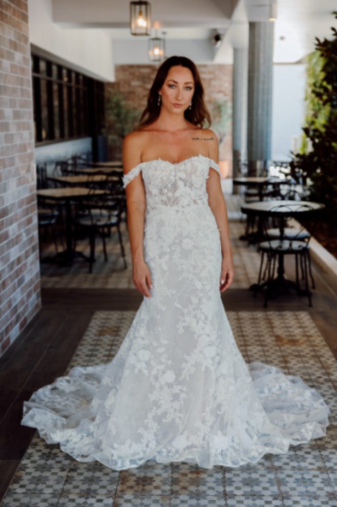 Heidi fit and flare wedding dress featuring a sweetheart neckline, sheer boned bodice, 3D floral lace appliqués and romantic lace train.