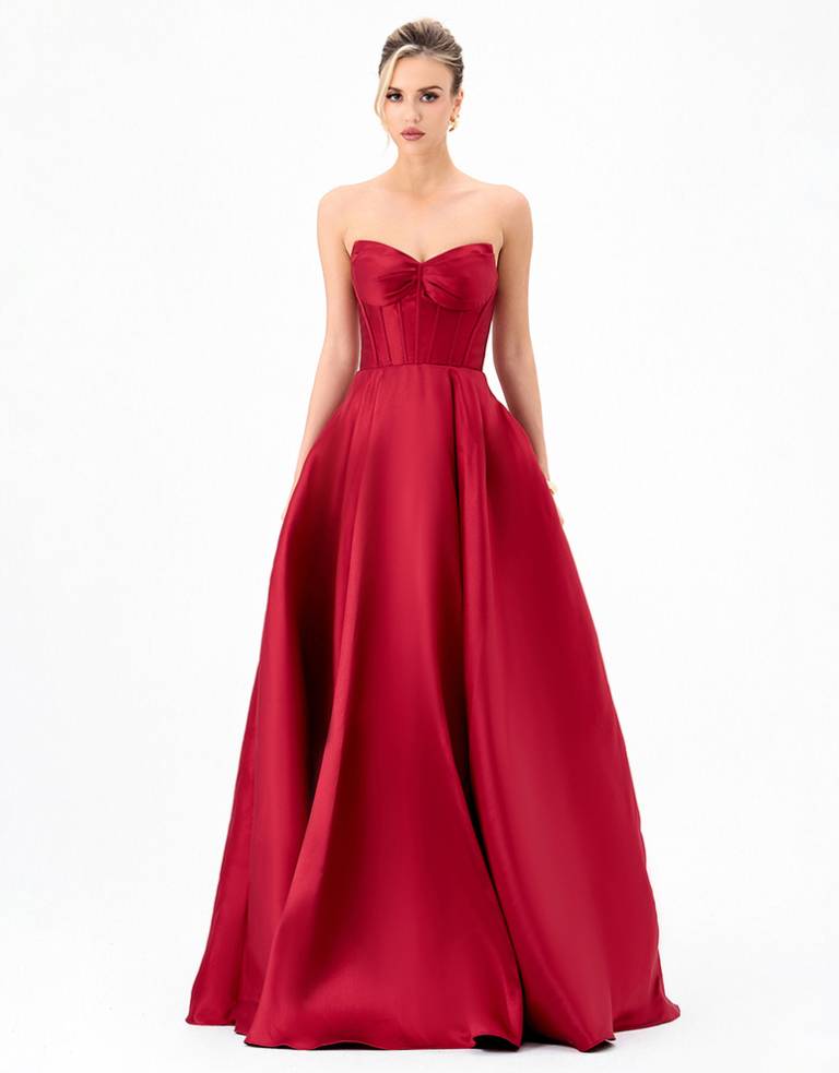 Deeba B84D0424 red strapless formal gown with a structured corset bodice, pleated bust and full ball gown skirt.