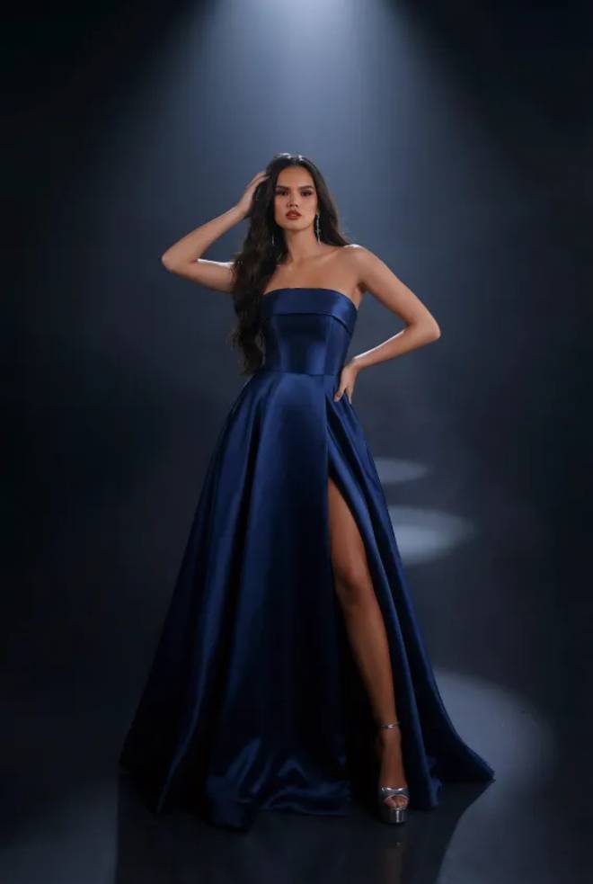 Nicoletta NC4007 navy satin formal gown with a strapless neckline, structured bodice, full A-line skirt and thigh-high split.