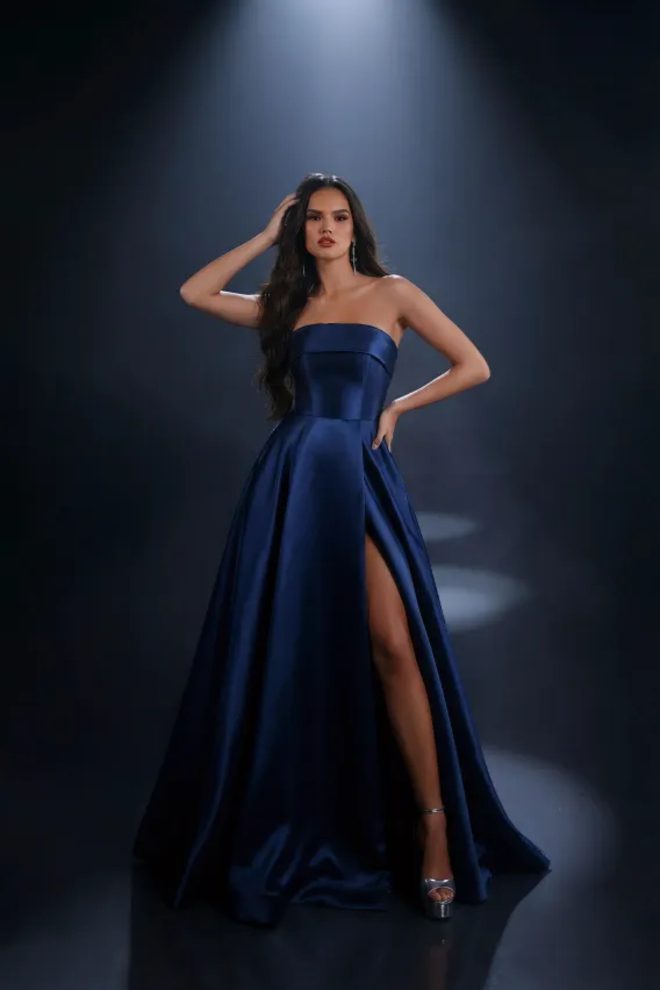 Nicoletta NC4007 navy satin formal gown with a strapless neckline, structured bodice, full A-line skirt and thigh-high split.