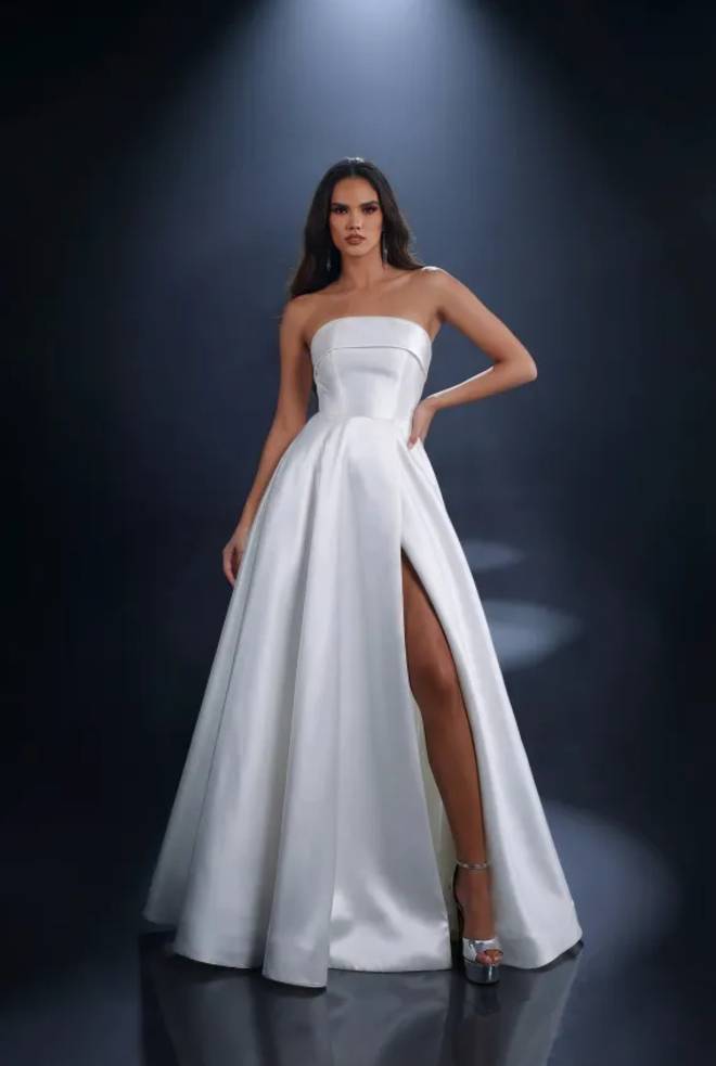Nicoletta NC4007 white satin debutante or wedding dress with a strapless neckline, fitted bodice, full A-line skirt and thigh-high split.