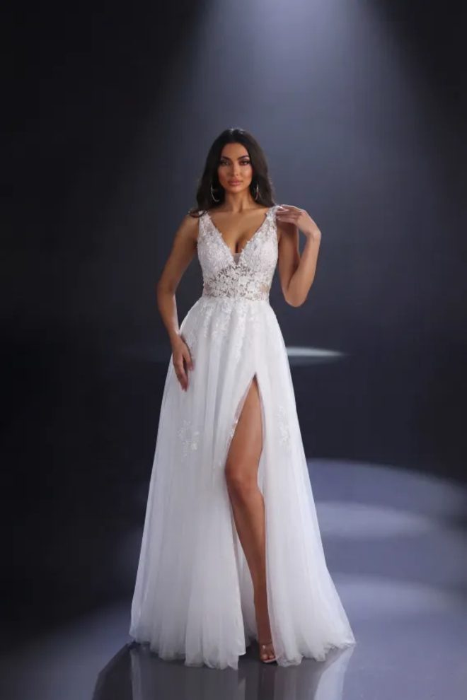 Nicoletta NC4023 ivory embroidered tulle wedding dress with plunging V-neckline, floral lace bodice and thigh-high split.