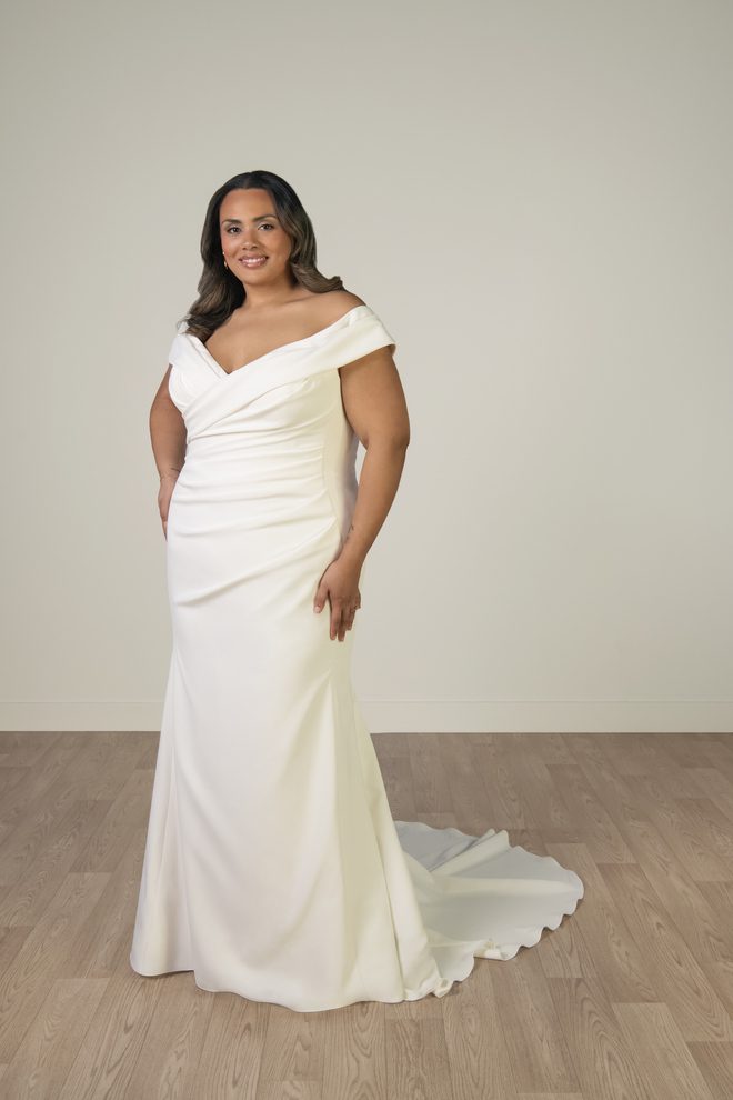 Stella York SY8330+ off-the-shoulder fit-and-flare wedding gown in stretch crepe with ruched bodice, front view.