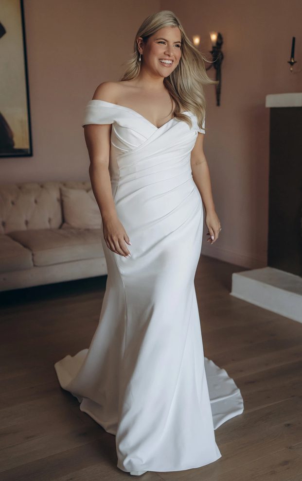 Stella York SY8330+ off-the-shoulder fit-and-flare wedding gown in stretch crepe with ruched bodice, front view.
