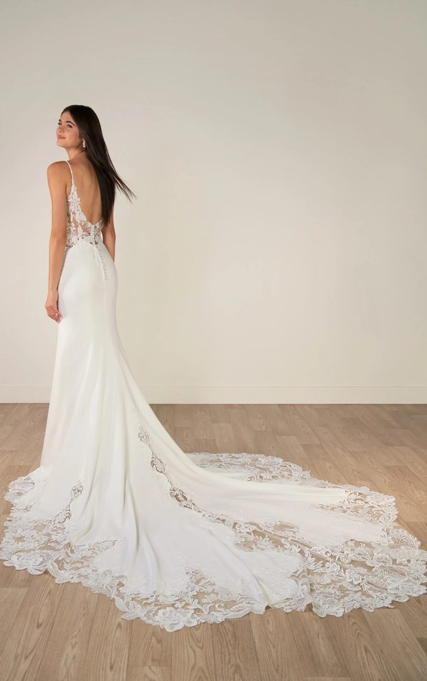 Back view of Stella York SY8340 wedding dress featuring a low open back, lace bodice detail, sleek crepe skirt and dramatic scalloped lace train.