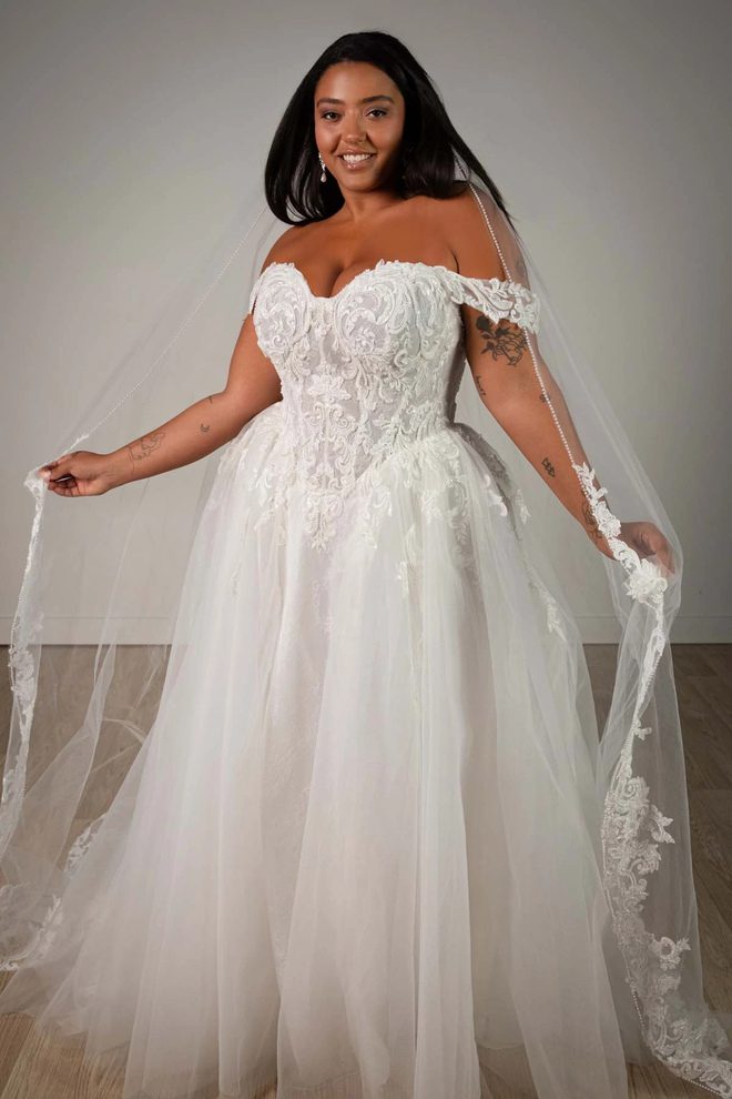 Stella York SY8345 ivory lace and tulle A-line wedding dress with sweetheart neckline and detachable off-the-shoulder floral straps.